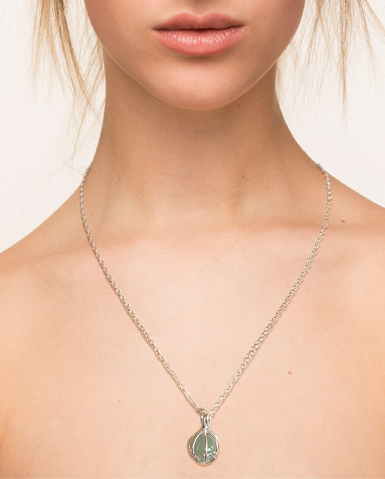 This is a photo of a model wearing the Green Aventurine gemstone silver pendant and chain.
